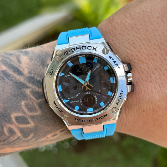 143 G shock Metalico correa azul claro